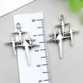 Antique silver star pendants, 4cm length shown with ruler measurement on gray background - Hollow Star (18729) / 1 Piece (23x29mm) / Antique Silver