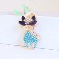 Golden cat keychain pendant featuring blue rhinestones and large black gem eyes - Blue