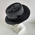 Detail of 3D skull reaper on black felt hat with lace and metal chain accent - Sad Reaper Handmade Hat with Feathers