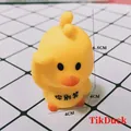 Cute yellow cartoon duck squeeze toy stress reliever with funny message on bright grid mat - Cartoon Duck Don't Laugh