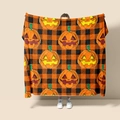 Halloween flannel blanket featuring cartoon pumpkins on black and orange checkered pattern - Style 65 (Halloween Black Orange Pumpkin Plaid)