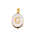Close-up of golden oval letter G pendant with white mother of pearl inlay detail - Gold Letter G