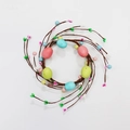 Detailed top view of Easter egg candle ring with colorful berries and faux vine base - 6 Easter Eggs Candle Ring 10cm