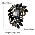 Broche de lujo con piedra preciosa gris oscuro y base dorada, de 6,2 cm x 5,4 cm - Negro