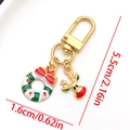 Christmas reindeer and wreath keychain with festive red bow on a gold finish metal ring - LS583-Christmas Reindeer Wreath U-shaped Keychain