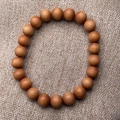 Natural light brown sandalwood beads bracelet on rustic linen texture background - Premium Single Loop / 08mm*22 Beads