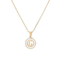 Minimalist gold chain necklace with white circular pendant featuring a gold G letter - Letter G