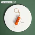 Portachiavi realistico con spiedino di polpette fritte e anello in lega dorata da 5,2 cm - Spiedino di polpette fritte
