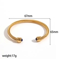 Golden twisted cable steel bangle featuring blue gemstone tips in an open cuff design - Gold / Lapis Lazuli (Blue)
