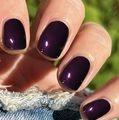 Close-up of short square dark purple nails with subtle pearl shimmer on hands - Glossy Pearlescent / Pearlescent Deep Purple (CW269)