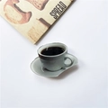 Retractable phone socket featuring a 3D coffee cup and saucer acrylic design - Cup