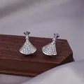 Silver-colored fan-shaped stud earrings with pave-set white cubic zirconia stones - E-041---Platinum