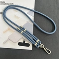 Close-up of blue 8mm braided phone lanyard with adjustable silver buckles and black patch - 8mm Dual Adjustable / Ink Blue
