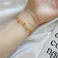 Double-layered gold bead bracelet with minimalist chain design worn on a female wrist - Gold Double Chain Bead Style (5364)
