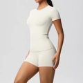 Side view of cream double-sided brushed tight athletic set with yoga tee and shorts - S / Top And Bottom / Light Ivory