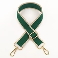 Detail of adjustable canvas shoulder strap with green geometric pattern and gold hardware - Green