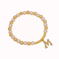 Elegant beaded bracelet featuring gold metal spheres, pearls, and a crystal M letter pendant - Letter M