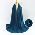 Navy blue pearl chiffon scarf for women shown on a professional mannequin display - Dark Blue