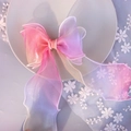 Detail showing gradient pearlescent organza bow hairclip with long flowing ribbons - 1238 Red Rainbow