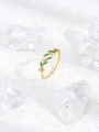 Detail of adjustable gold leaf ring with green marquise stones and clear crystals - Green