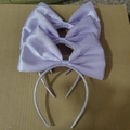 Three large purple satin bow headbands for girls displayed on a textured surface - Satin Bow / Purple