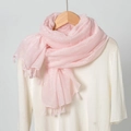 Pink cotton linen scarf with white embroidery and tassels on a wooden hanger - Pink