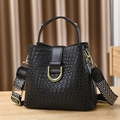 Black woven bucket bag with gold U-buckle and geometric wide strap in variant view - Woven-Black