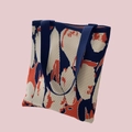 Knitted tote bag featuring dark blue and orange abstract patterns with sturdy handles - Navy Orange Stone