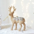 Golden Christmas reindeer ornament with glitter and silver sequins on a warm festive background - Sequin Pendant / Sequin Champagne Reindeer