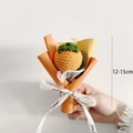 Close-up of a handmade crochet persimmon flower bouquet with ribbon and size detail - Mini Persimmon Bouquet