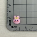 Close-up of a mini pink resin bunny cabochon with bow detail and cm ruler measurement - Pink Rabbit with Yellow Bow