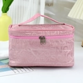 Pink portable makeup bag with letter pattern and top handle for travel organization - Pink