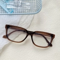 Retro cat eye sunglasses in transparent tawny color with detailed temple specs - Transparent Tea White Lens