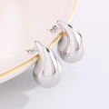 Polished silver hollow teardrop earrings hanging on a luxury ceramic dish edge - Large Silver (32mm*18mm)