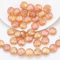 Macro detail of spiral round crystal glass beads in golden pink for DIY jewelry making - Wine Red Plated
