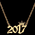 Gold plated 2017 year pendant necklace with crown detail on a sleek black background - 2017 / Gold
