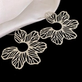 Macro shot of large silver hollow flower earrings with vintage leaf texture on black background - Silver Hollow Large Floral Stud Earrings (17#)