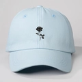 Detail of light blue baseball cap featuring a black rose floral print design - One Size / Sky Blue