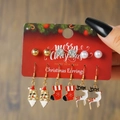 Christmas earring set with red bells, snowflakes and Santa studs on wooden background - E1197-1 (6 Pairs Christmas Set)