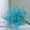 Artificial blue baby's breath flower bouquet in a white metal basket for home decor - Teal Blue