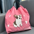 Detail of pink nylon bag with embroidered French Bulldog, hearts and woven handles - Pink Bulldog / M