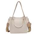 Chic cream white bucket bag with striped strap and floral charm accessory - White