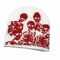 Detailed close-up of knitted beanie with red skeleton jacquard pattern on white base - Red Skull-White