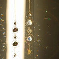 Golden suncatcher wind chime featuring crystal beads and fairy moon pendants - Design No.11