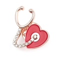 Broche stéthoscope or rose avec cœur en émail rouge et accents de zircon brillant - Stéthoscope Coeur-2