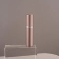 Portable 10ml bronze aluminum perfume sprayer with inner glass vial on acrylic block - 10ml / Brown