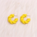 Modern bright yellow twisted C-shape hoop earrings with a matte textured finish - Yellow Twisted