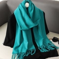 Detail of lake blue cashmere-feel scarf with tassel fringe on black clothing - Lake Blue