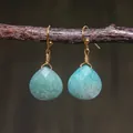 Macro detail of teardrop faceted amazonite stone earrings with hand-wrapped gold wire - Light Green Faceted Amazonite Style (ER1060-5)