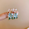 Floral stud earring set with pink and blue gradient enamel petals and gold leaf accents - Pink Blue Gradient Flower Style (HE21873)